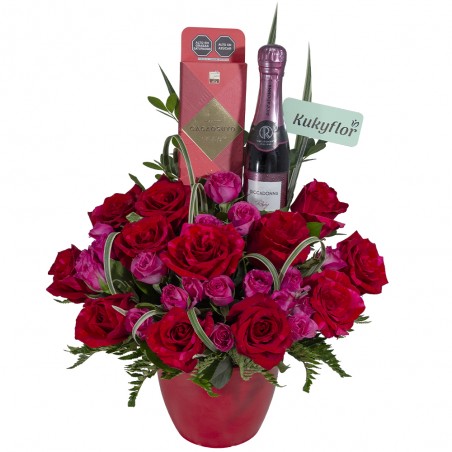 Arrangement of 12 red roses, 5 mini roses with wine and chocolate