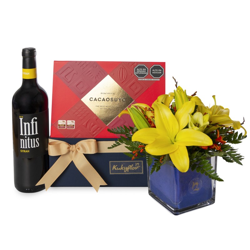 Pack of lilies with chocolates and wine