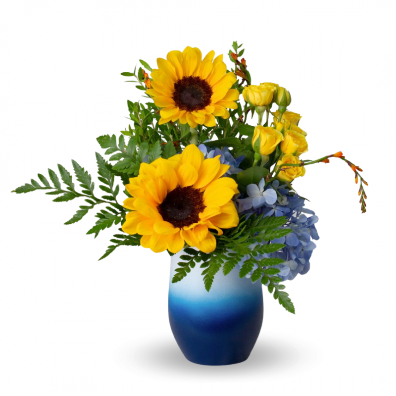 Arrangement of sunflowers, mini roses with hydrangea in a vase holder