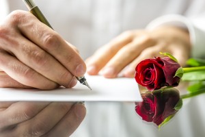 Romantic man writing a love letter